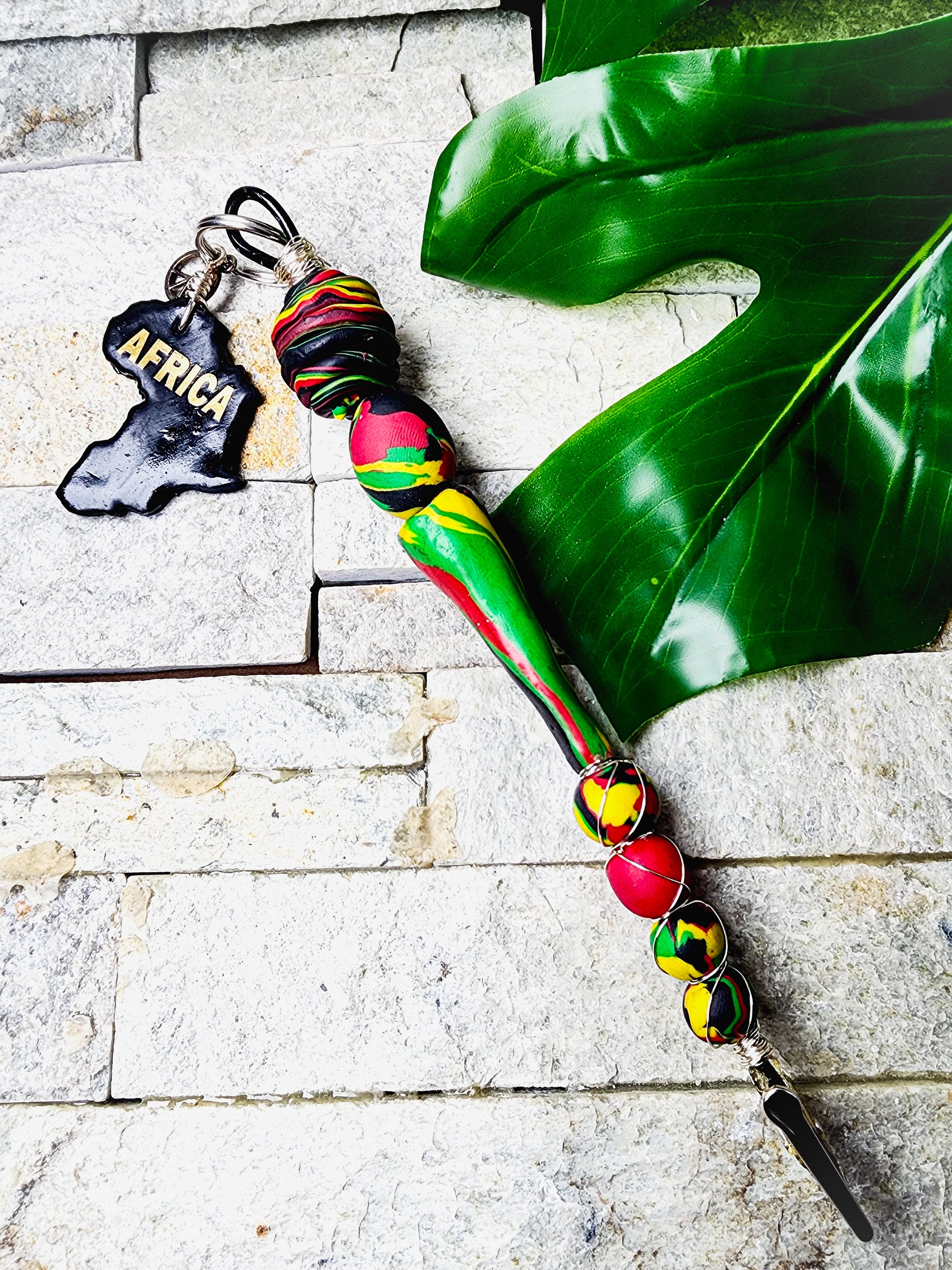 Pan-African inspired card clip with handcrafted polymer clay beads