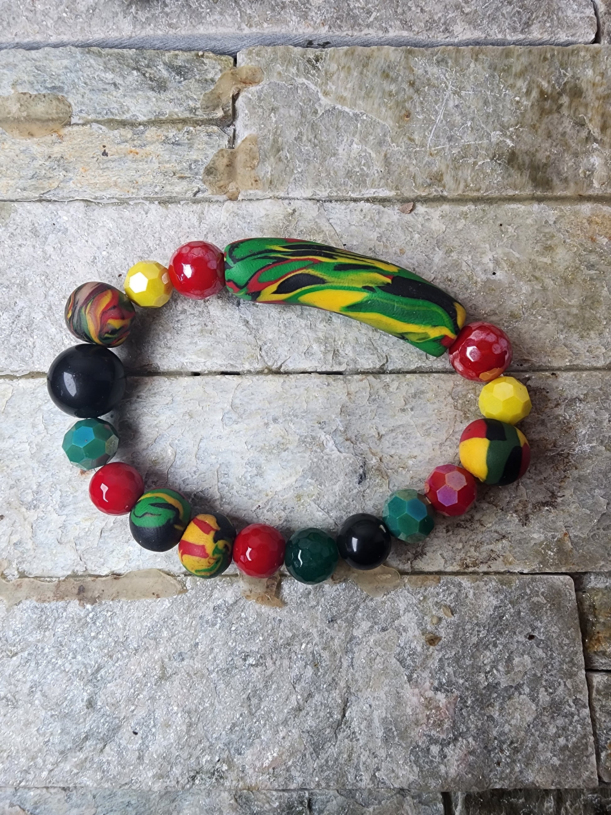 AARIA BRACELET WITH PAN-AFRICAN POLYMER CLAY BEADS AND MATCHING CRYSTALS - HANDCRAFTED TRIBUTE TO HERITAGE, ENERGY, AND PRIDE.
