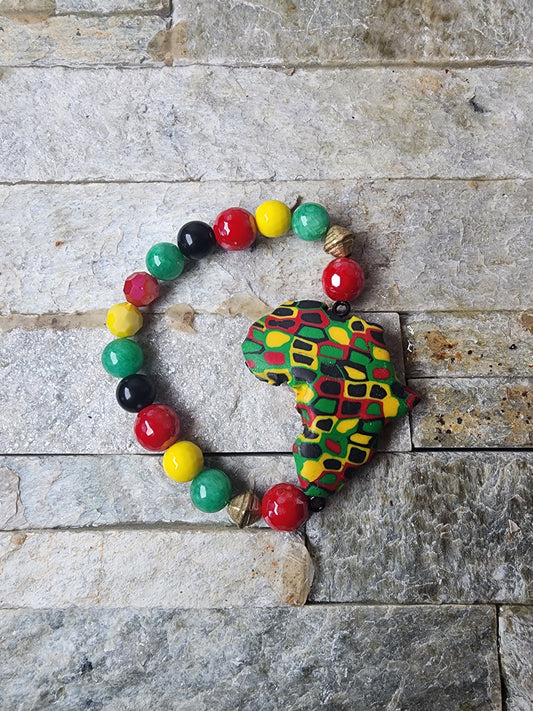 Handmade bracelet with polymer clay beads in Pan-African colors,  jade gemstones, and a bold Africa-shaped focal bead — honoring heritage and spiritual power.