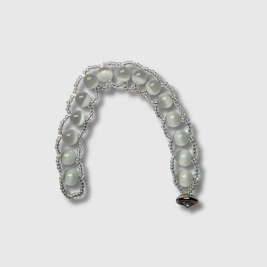 Cat’s Eye beaded bracelet sewn with needle and thread, featuring a cup button clasp and seed beads — handcrafted by JvOR