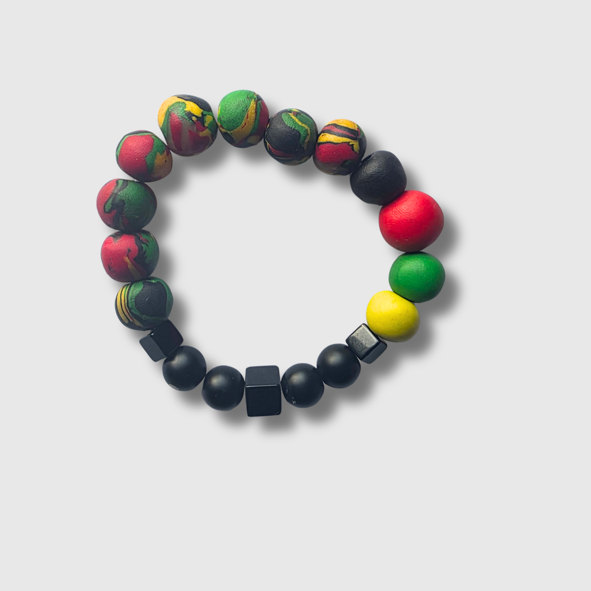 Ancestor’s Staff bracelet with black onyx round and cube beads and polymer clay in Pan-African colors — protection and heritage jewelry by JvOR