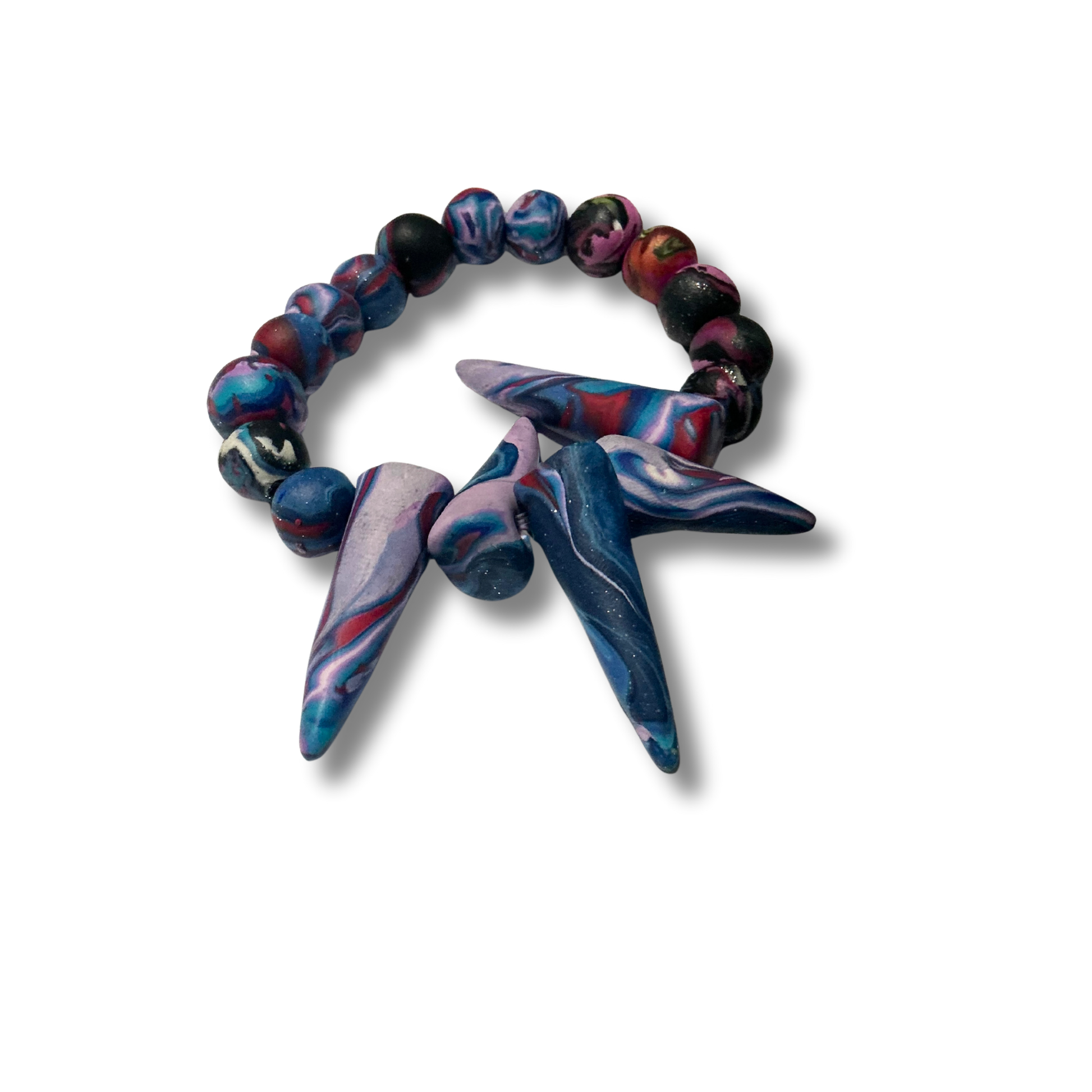 Bold handmade polymer clay bracelet with vibrant colors, featuring statement beads and some designs with spiked accents.
