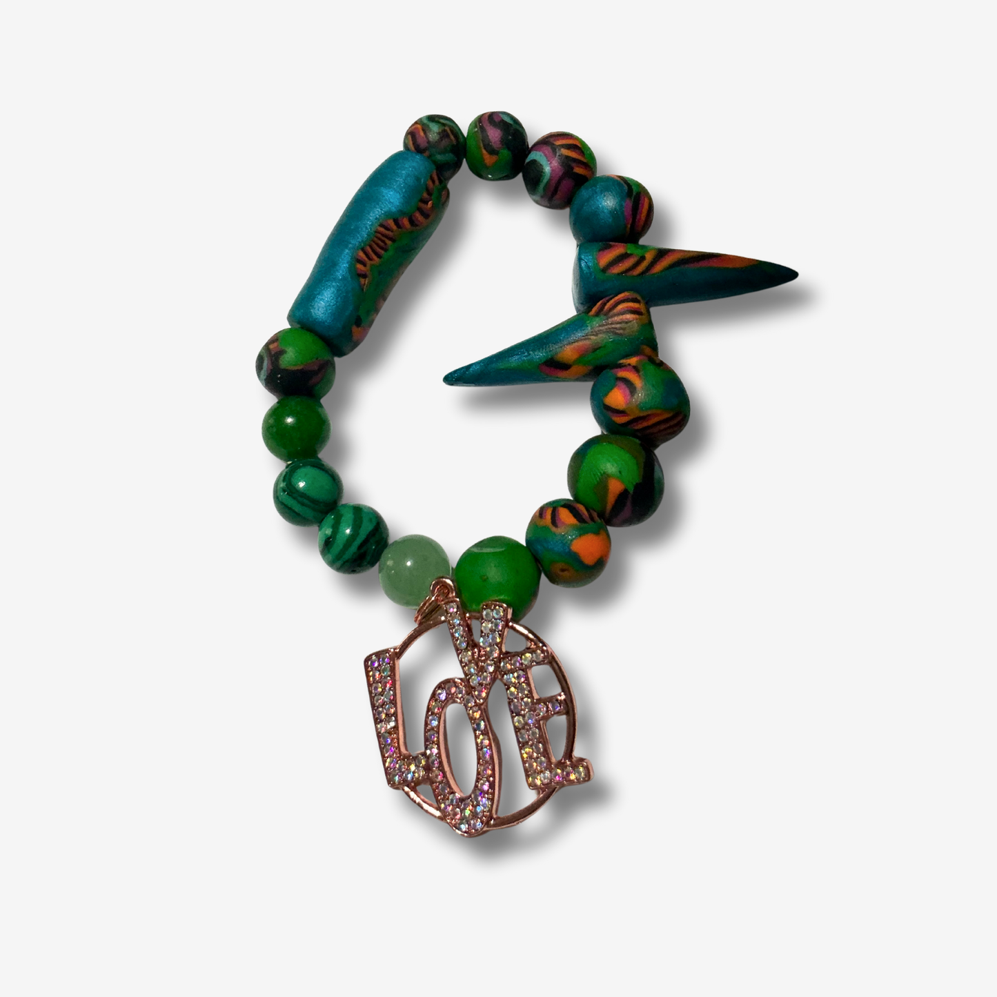 Bold handmade polymer clay bracelet with vibrant colors, featuring statement beads and some designs with spiked accents.