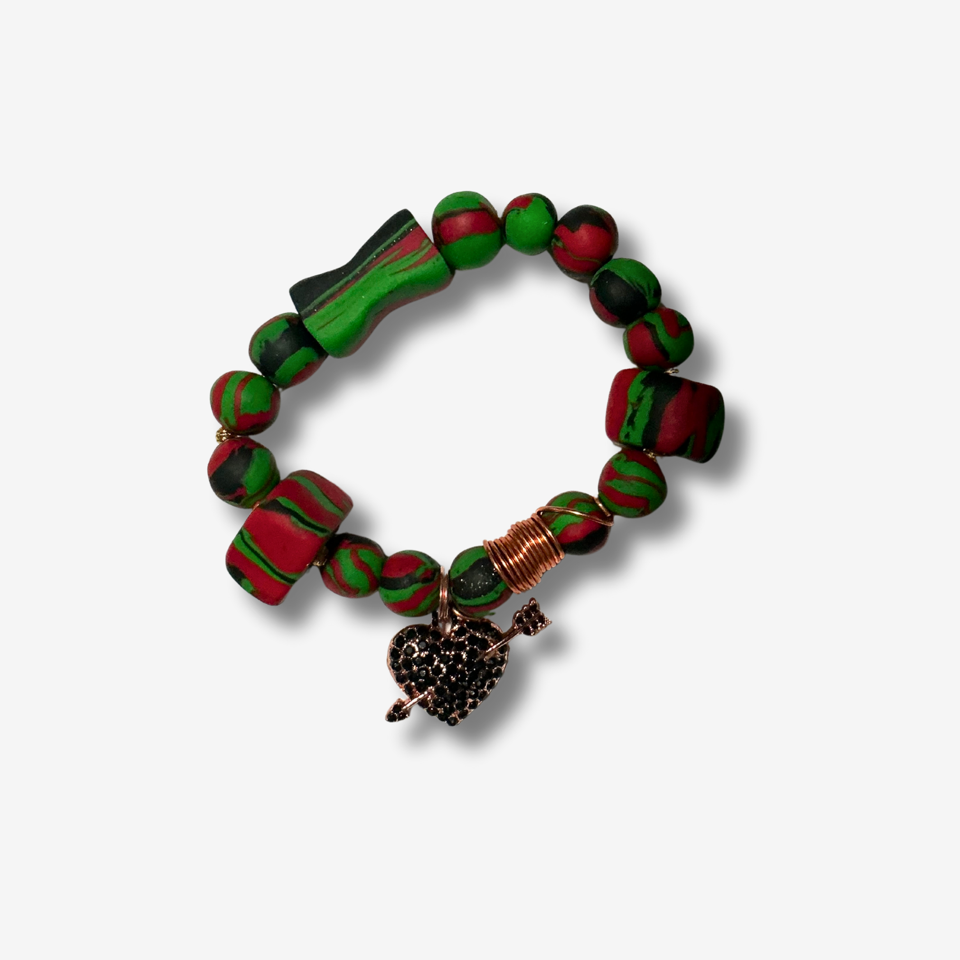 Handmade Pan-African polymer clay bracelet in red, black, and green beads, with copper coils and charms for women