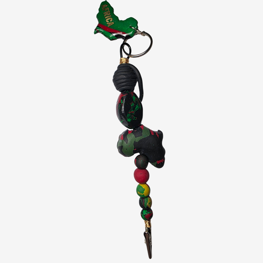 Handmade polymer clay card clips in Pan-African red, green, and black with bold textures and unique designs — functional accessories that celebrate culture and creativity