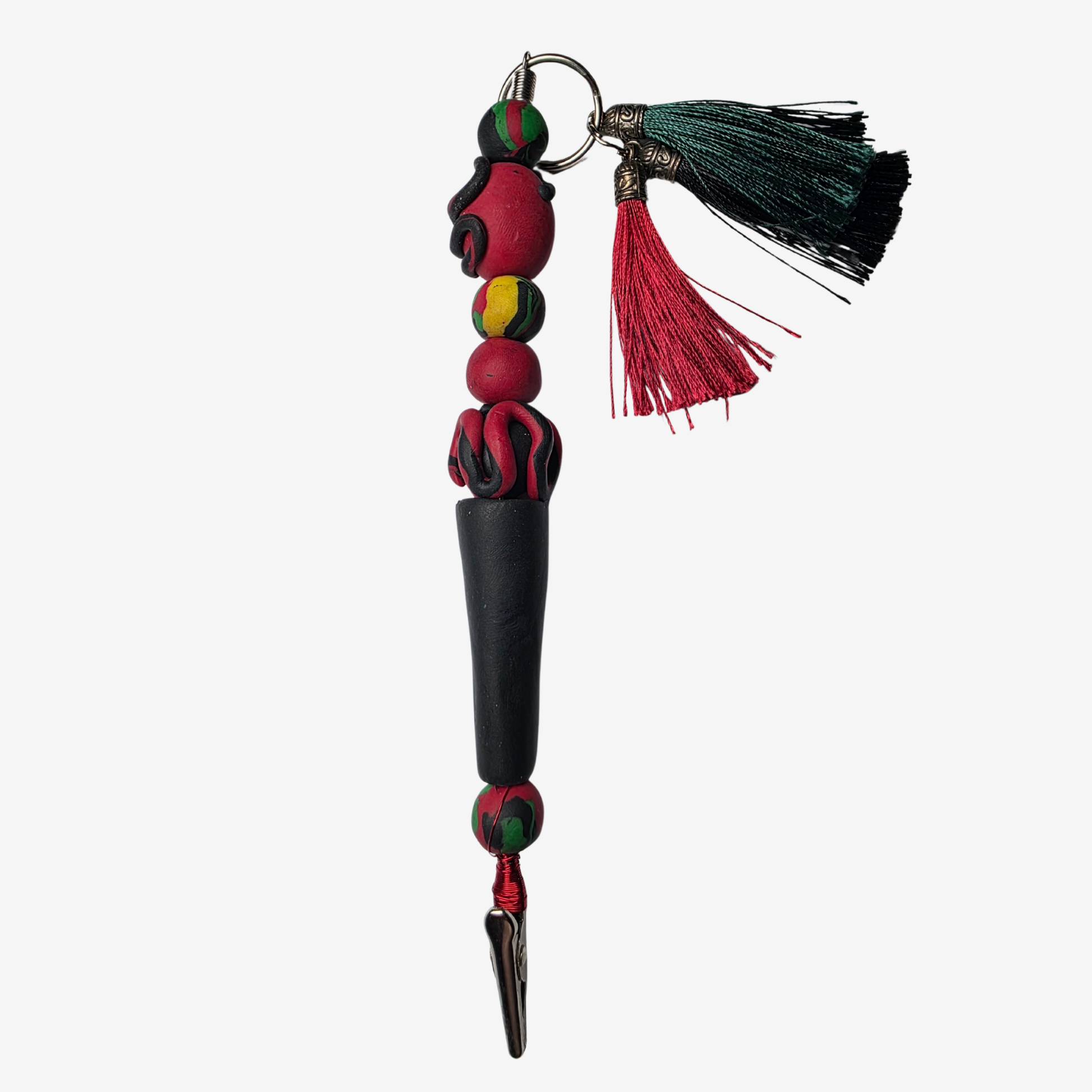 Handmade polymer clay card clips in Pan-African red, green, and black with bold textures and unique designs — functional accessories that celebrate culture and creativity