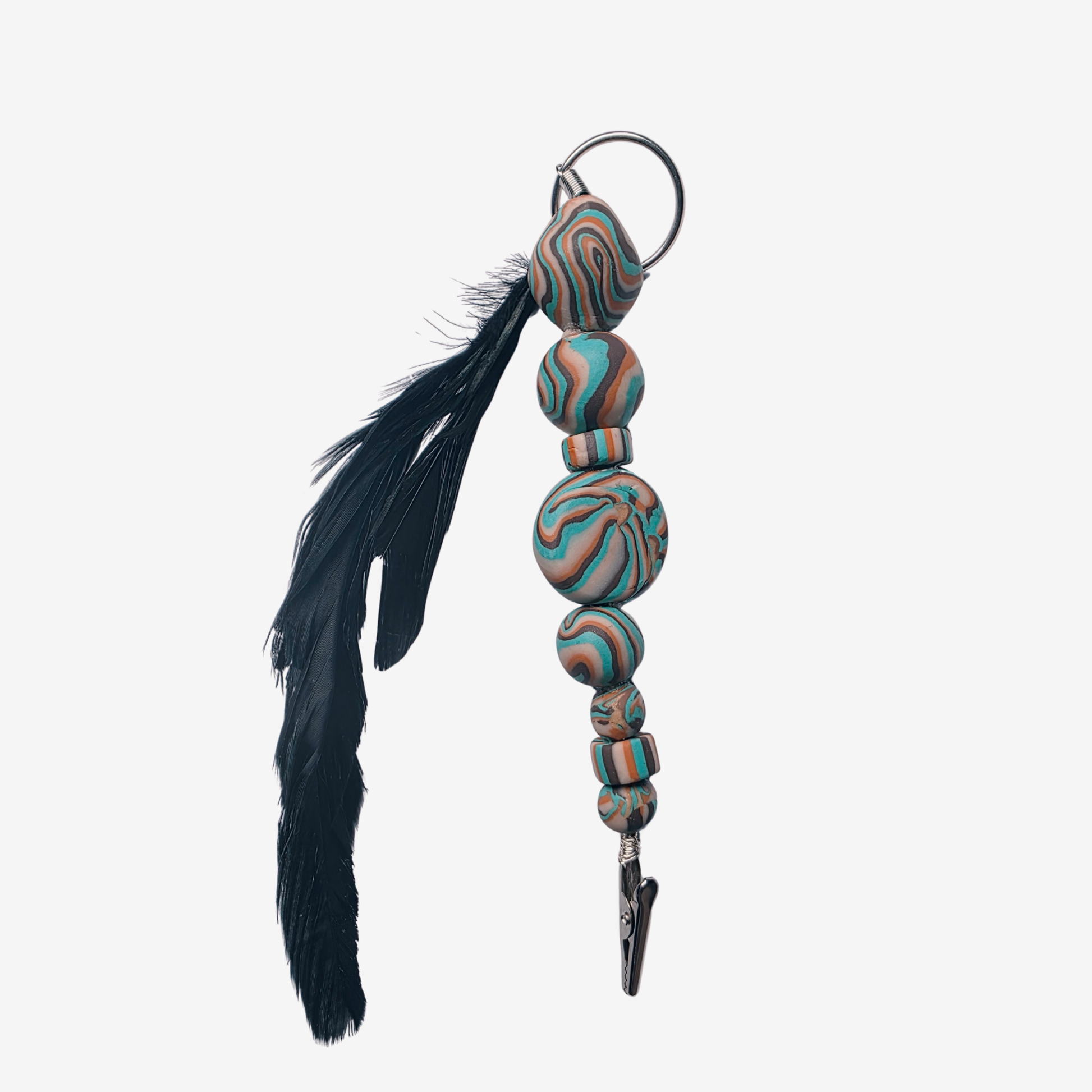 Colorful polymer clay card clips with bold patterns, spikes, roses, feathers, and sculpted designs — wearable mini artworks that fuse art, originality, and utility