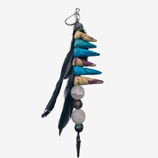 Colorful polymer clay card clips with bold patterns, spikes, roses, feathers, and sculpted designs — wearable mini artworks that fuse art, originality, and utility