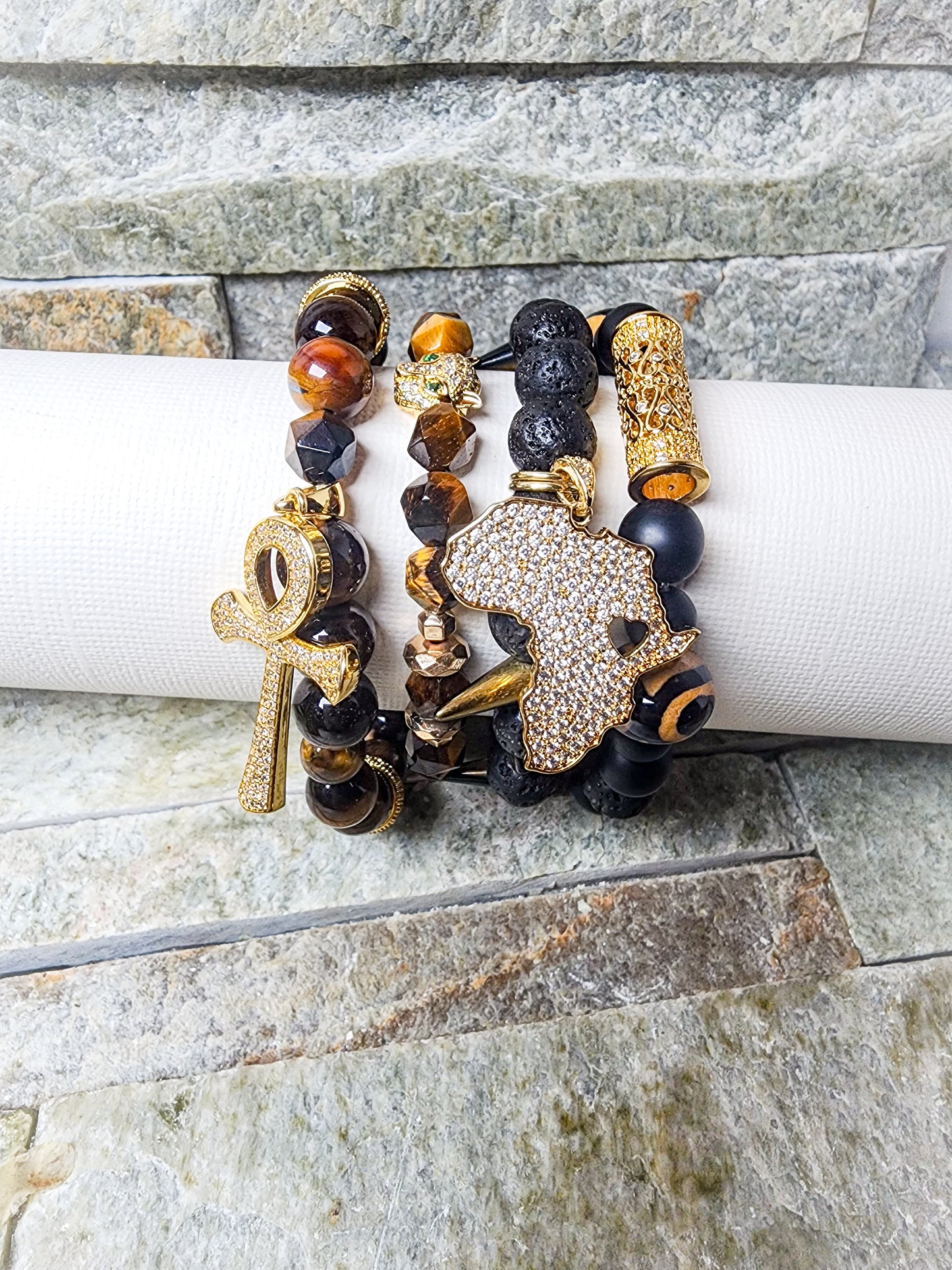 KALI BRACELET STACK IN EARTHLY BLACK AND GOLD WITH AFRICAN MOTIFS - SACRED PROTECTION & ANCESTRAL CONNECTION IN EVERY LAYER.