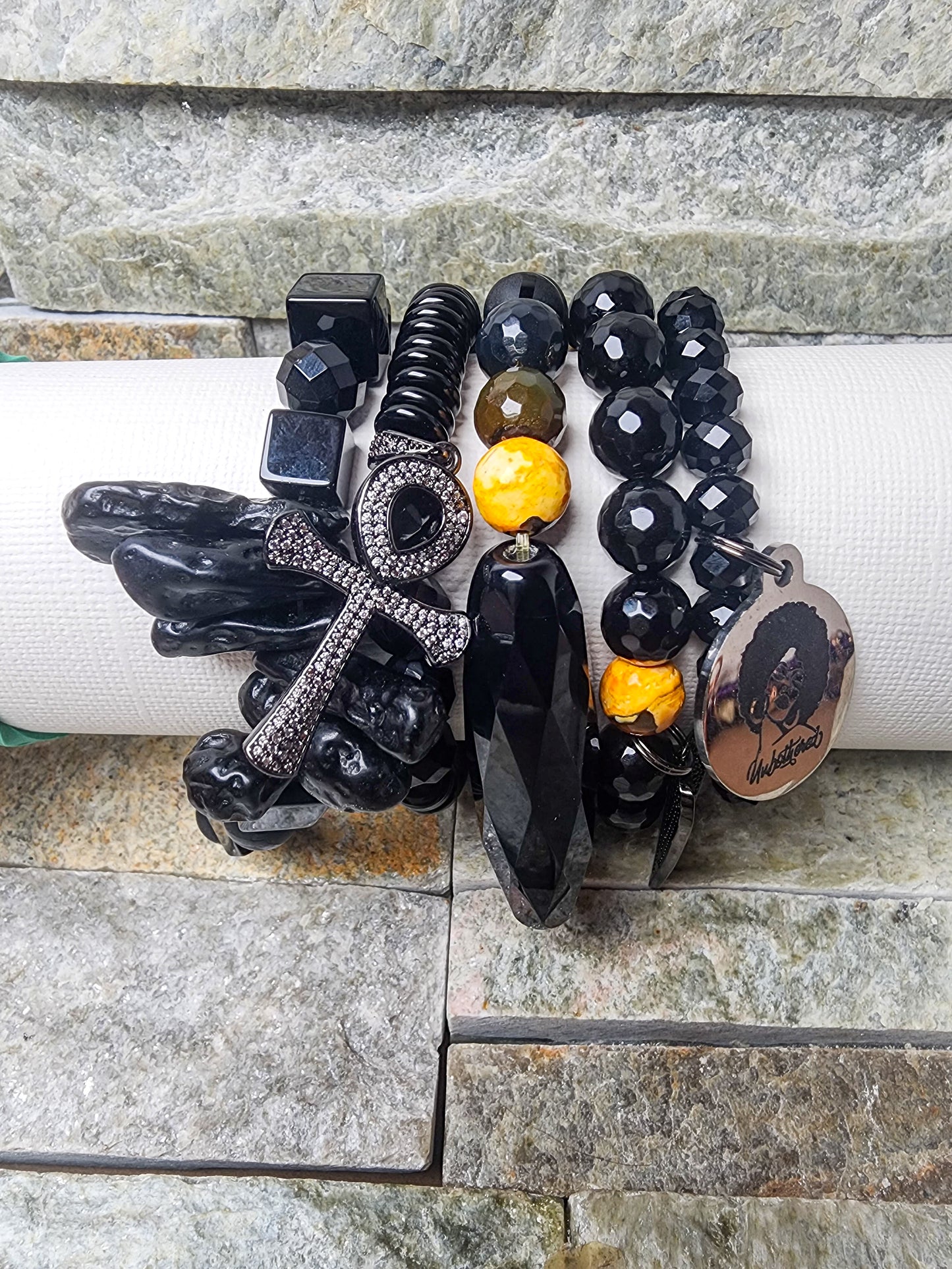 PULSATE EARTH’S SYMPHONY STACK IN BLACK & GOLD - HARMONIZING EARTHLY POWER WITH SOULFUL CRYSTAL FLOW.