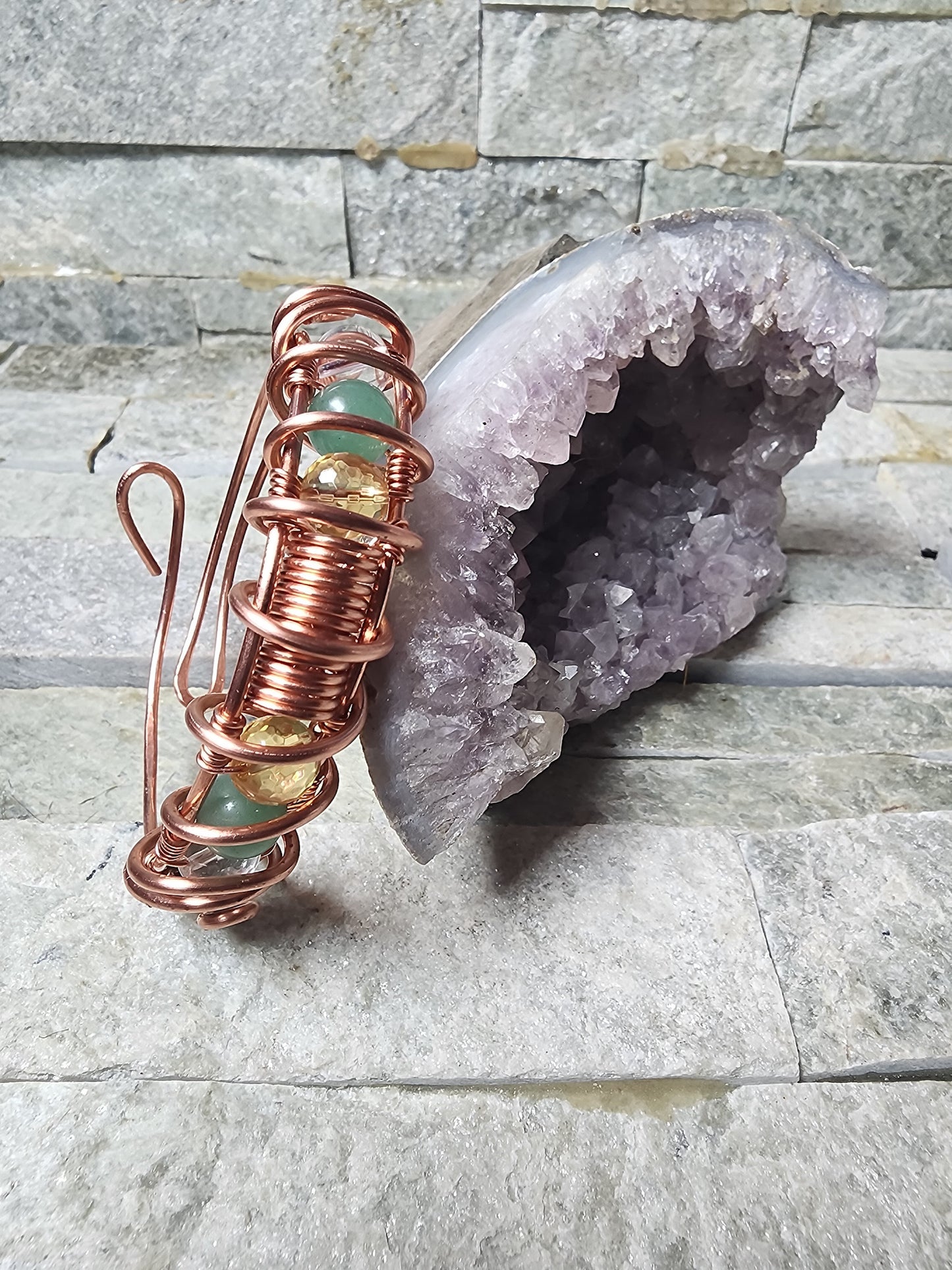 The Midas Touch copper wire-wrapped bracelet with Pyrite, Citrine, Green Aventurine, and Clear Quartz for abundance, manifestation, and prosperity energy.