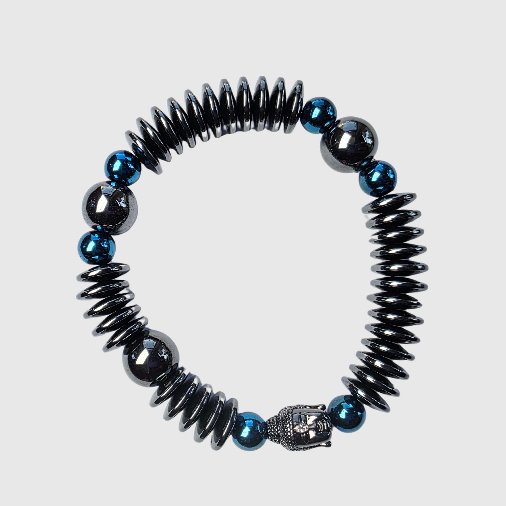 Men’s grounding bracelet with hematite rondelles, deep blue hematite accents, and Buddha centerpiece – strength and clarity jewelry