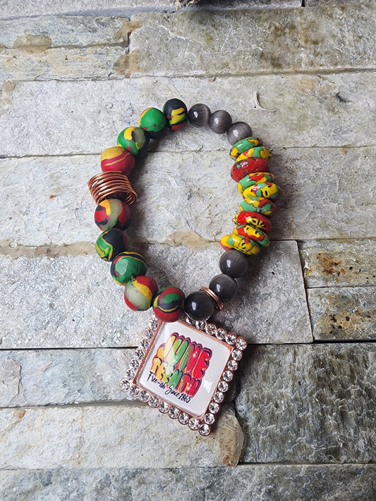 AAMINA BRACELET WITH PAN-AFRICAN CLAY BEADS, CATS EYE, & KROBO BEADS - HANDCRAFTED FOR CLARITY, PROTECTION, AND ANCESTRAL ENERGY.