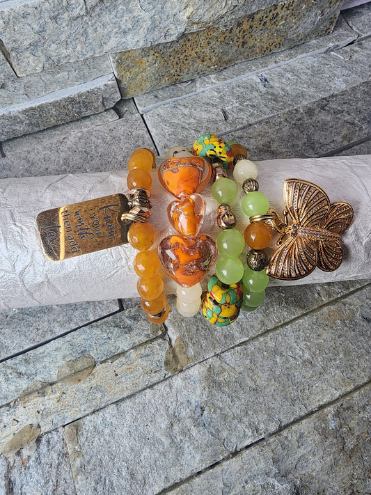 BOUNDLESS BRACELET STACK HONORING LEUKEMIA WARRIORS - ORANGE AND GREEN CLAY WITH CRYSTALS FOR HOPE AND TRANSFORMATION.