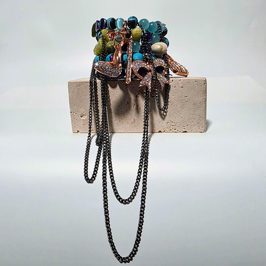 Jasper Rebellion bracelet — blue imperial jasper, purple jade, citrine, and clay beads with cowrie shells and gunmetal chains.