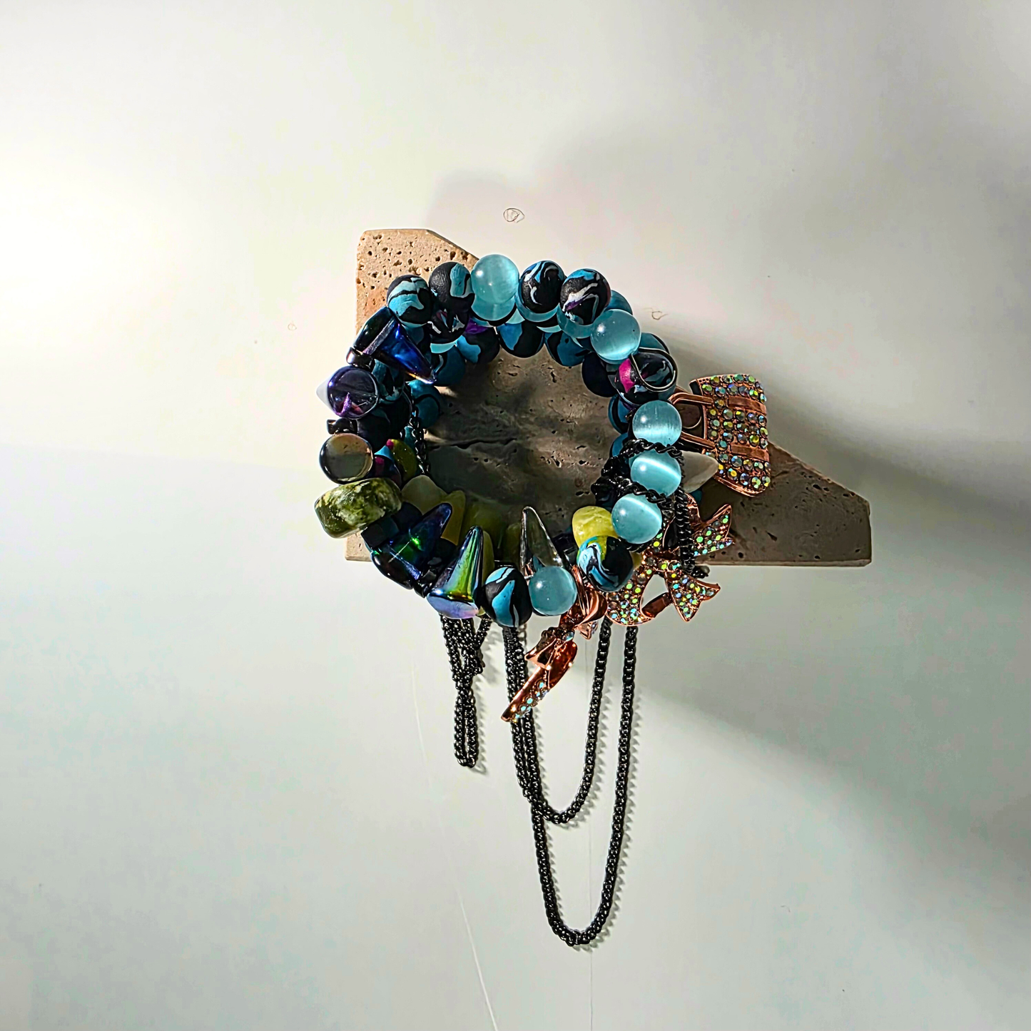 Multi-crystal statement bracelet featuring jasper, jade, citrine, clay beads, and gunmetal chain accents.