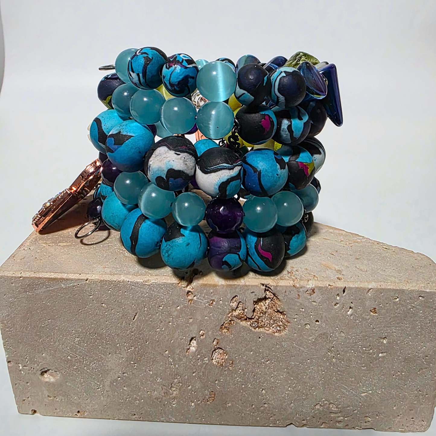 JvOR Jasper Rebellion bracelet — bold crystal and clay design with cowrie shells and metal chain details.