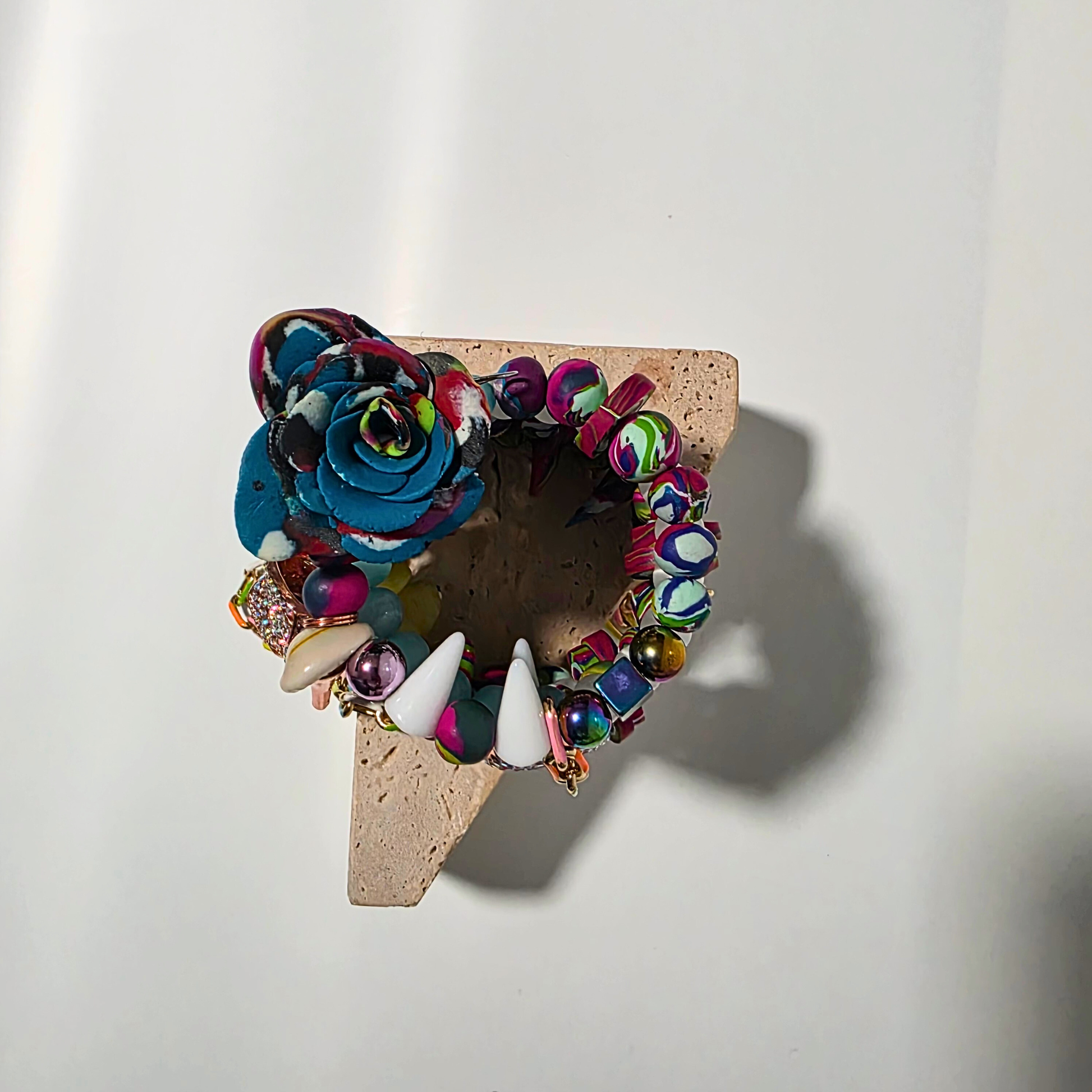 Bold wrap bracelet with mixed gemstones, polymer clay, and dangling chain details — Chromatic Frenzy.