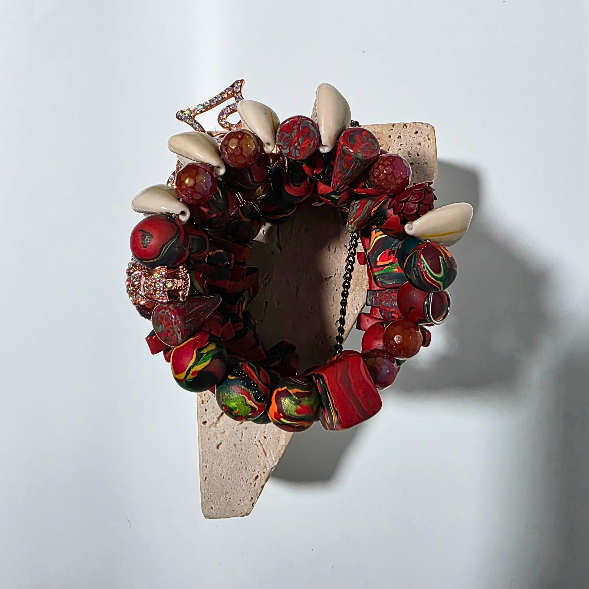 Artisan bracelet with agate crystals and handcrafted clay beads in ember-colored palette