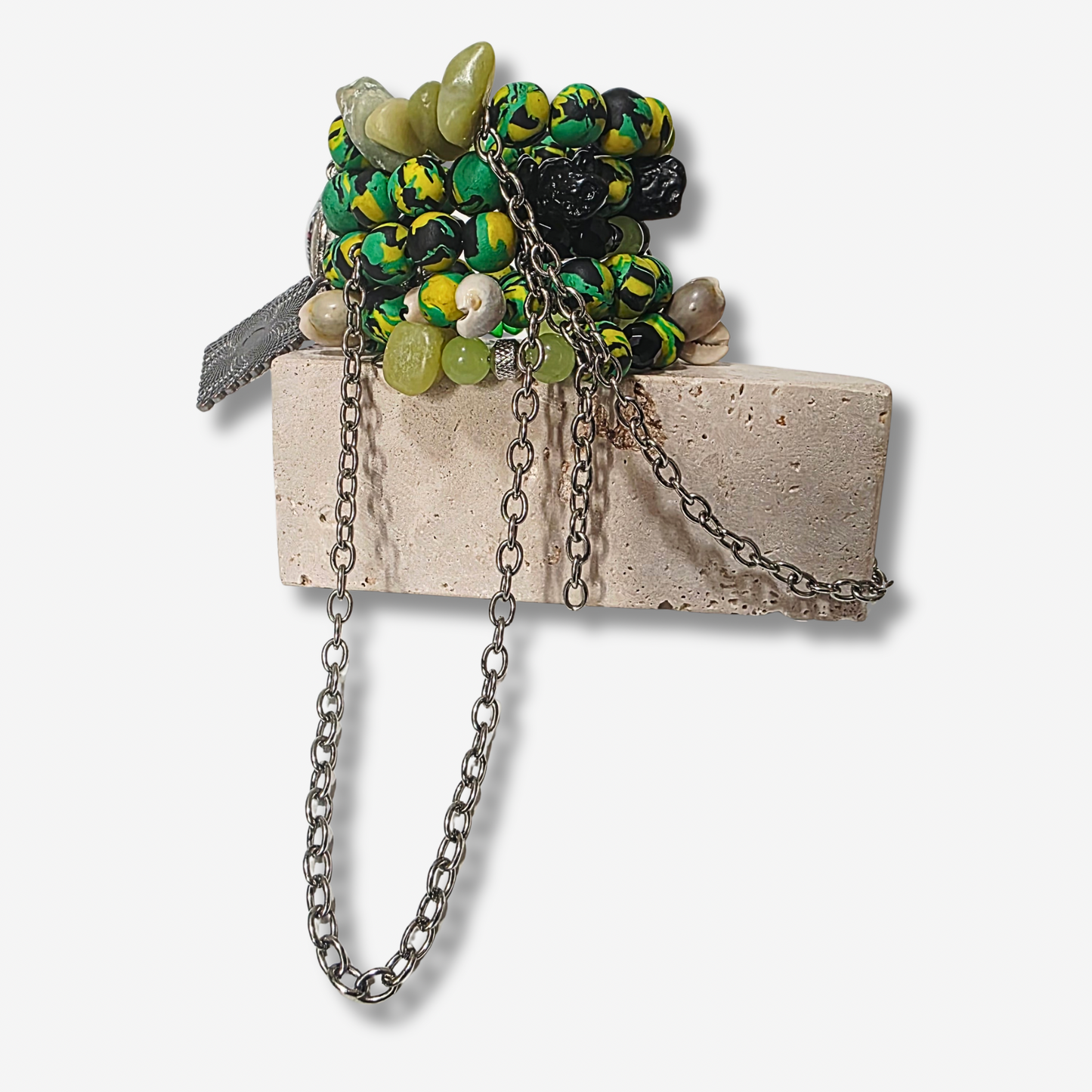 Handmade 4-loop metal wrap bracelet with Pan-African clay beads, cowrie shells, and dangling gunmetal chains.