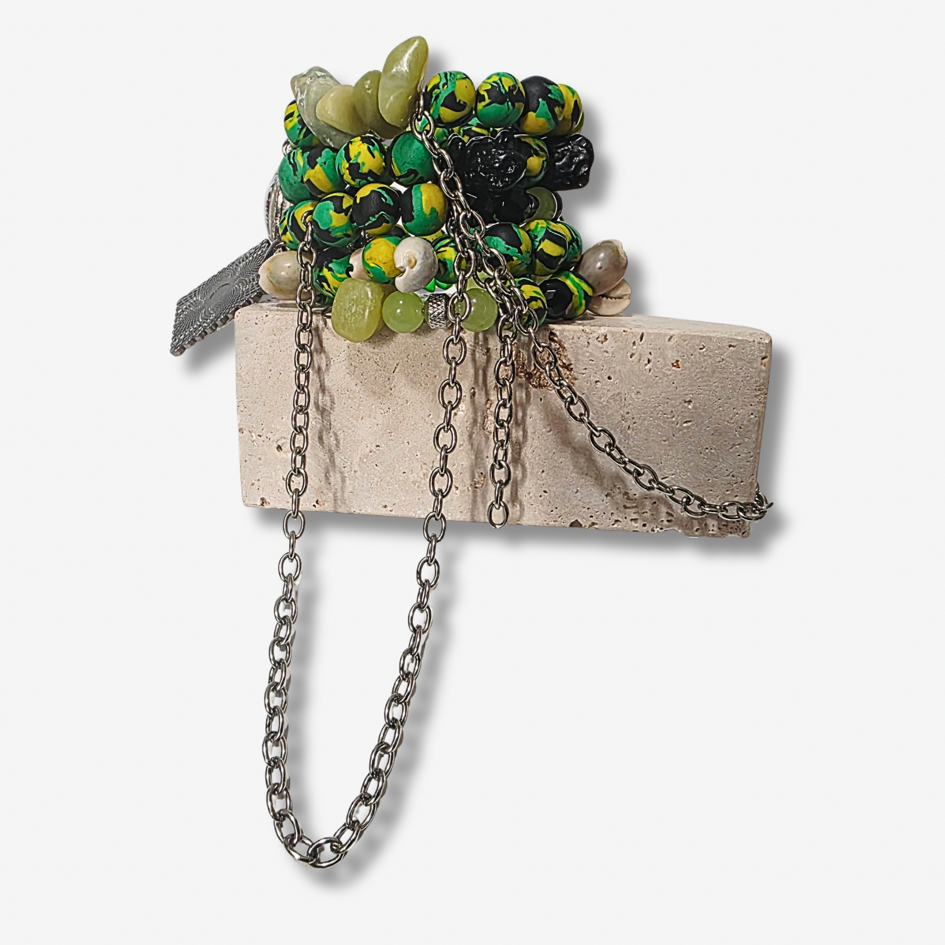 Handmade 4-loop metal wrap bracelet with Pan-African clay beads, cowrie shells, and dangling gunmetal chains.