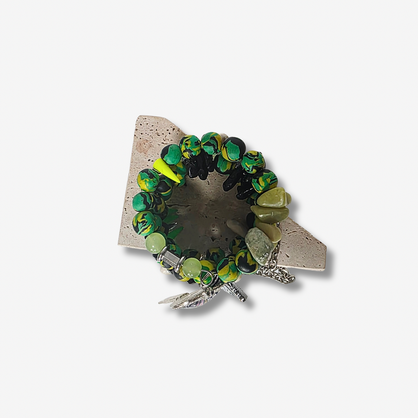 Top view of Jamaican Sirenblade wrap bracelet featuring Jamaican clay beads, black agate crystals, and statement rhinestone charms.