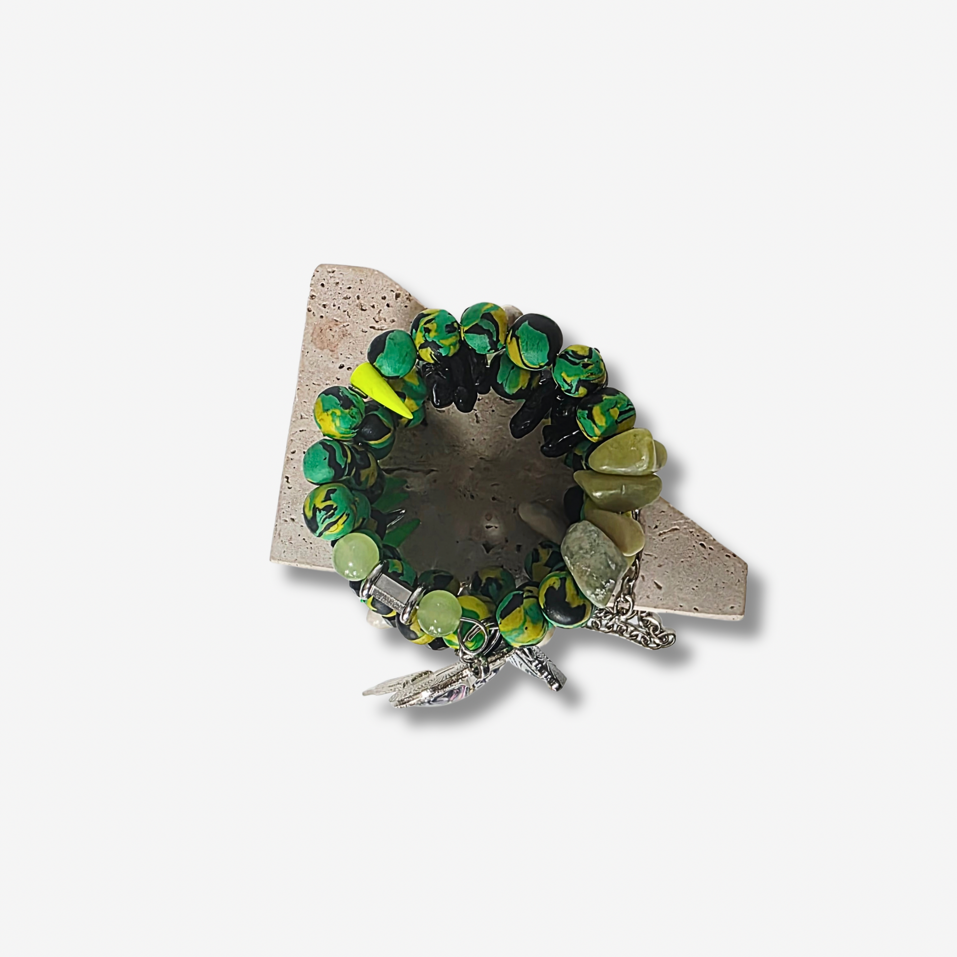 Top view of Jamaican Sirenblade wrap bracelet featuring Jamaican clay beads, black agate crystals, and statement rhinestone charms.