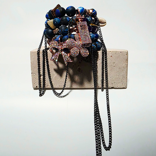 Ivory Riot bracelet — white cat’s eye crystals, handmade clay beads, sterling-silver chains, three rhinestone charms, multi-layer wrapped bracelet by JvOR.