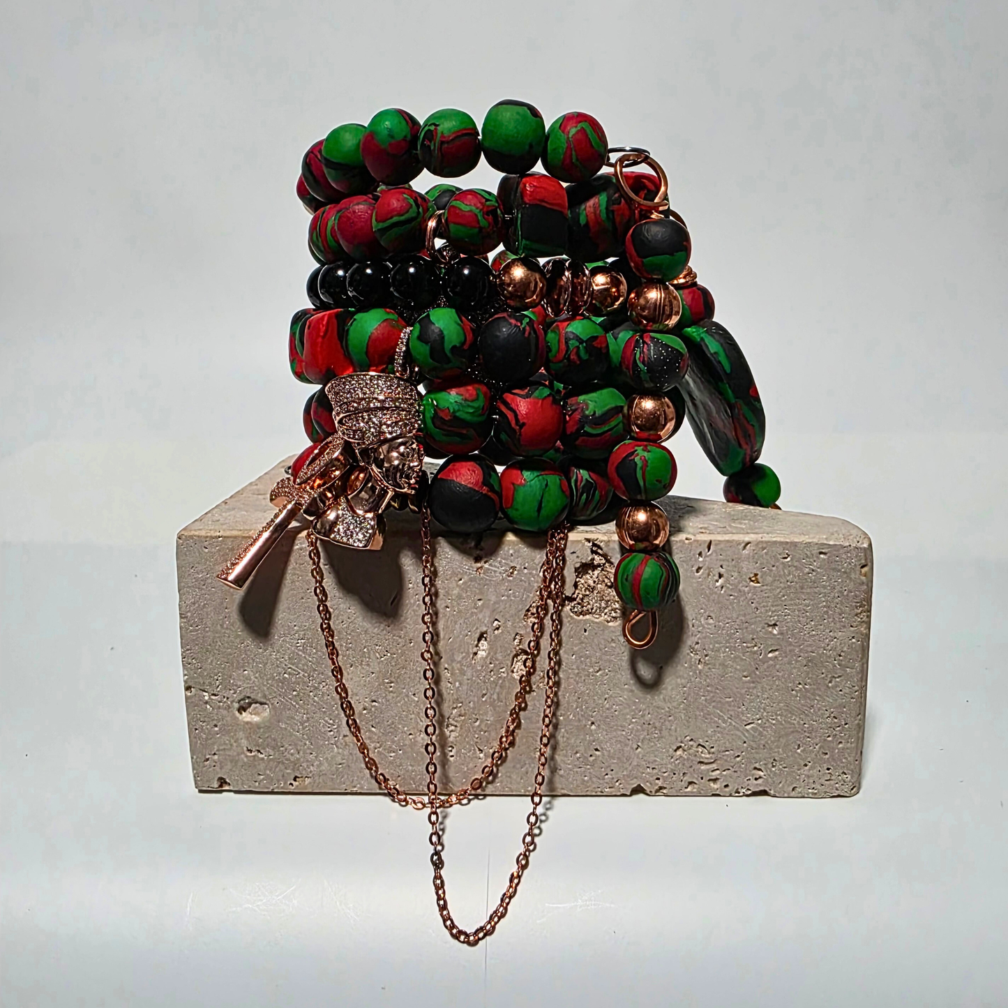 Pan-African clay bead bracelet with copper chains and crystal accents