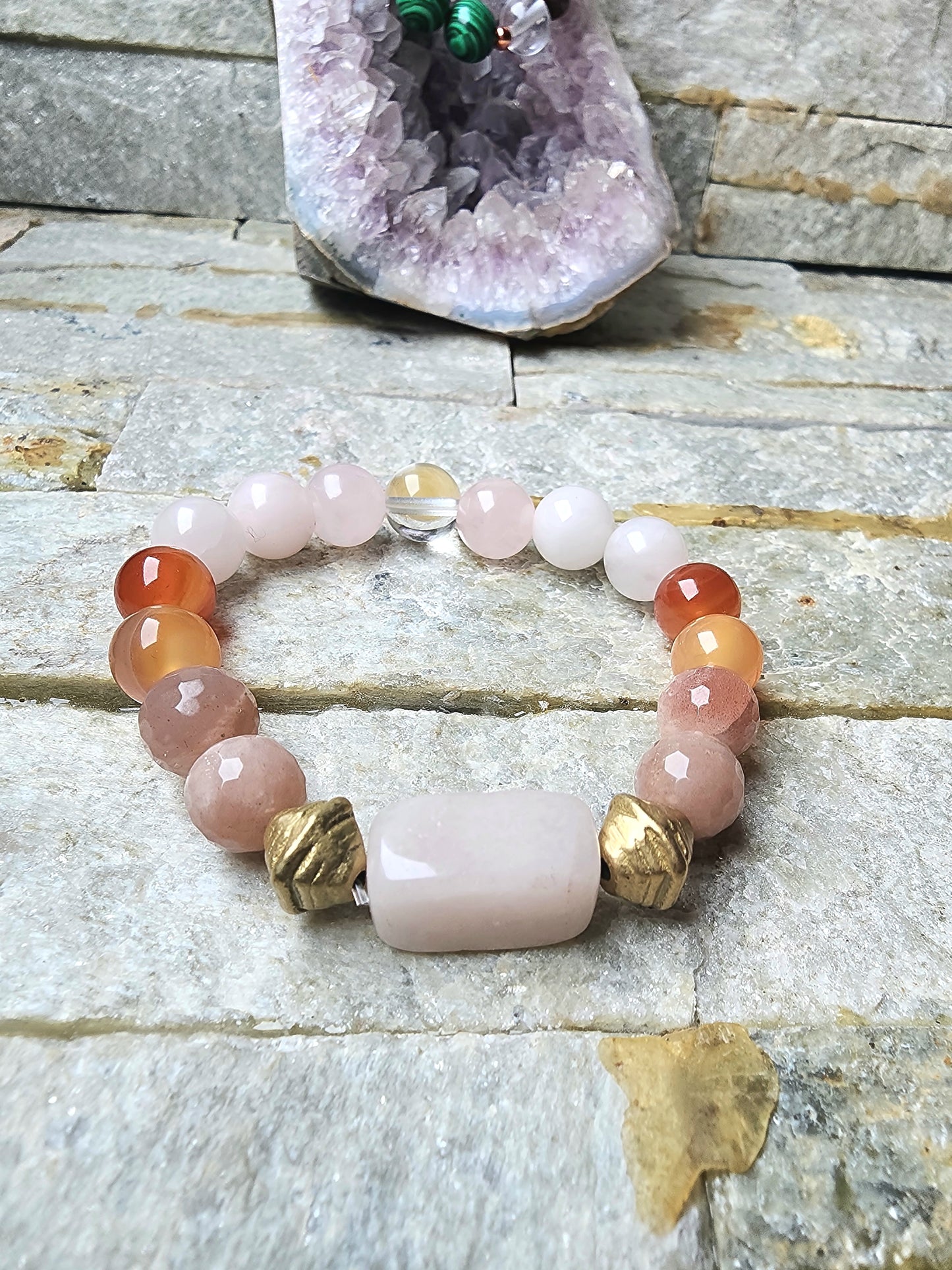 Elysian Bracelet made with carnelian, rose quartz, sunstone, citrine, and clear quartz worn on right wrist for love, confidence, clarity, and manifestation