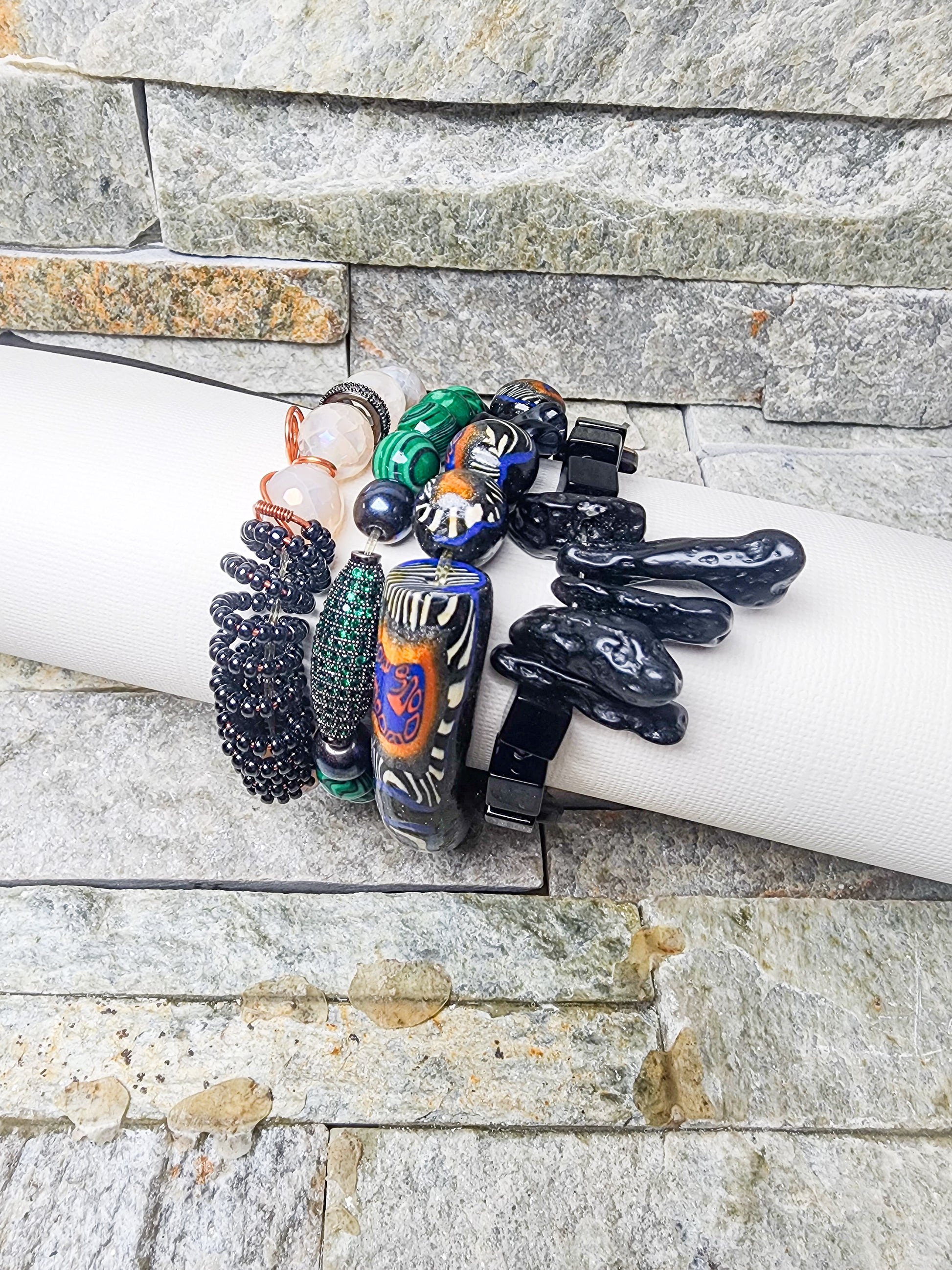 Stacked bracelet sets featuring handcrafted polymer clay beads, crystal accents, and powerful charms — a bold fusion of art, energy, and affirmation”