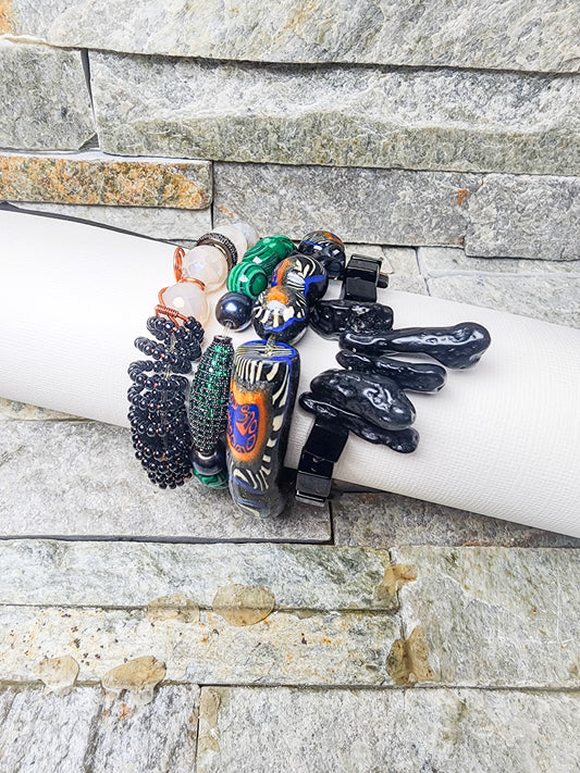 Stacked bracelet sets featuring handcrafted polymer clay beads, crystal accents, and powerful charms — a bold fusion of art, energy, and affirmation”