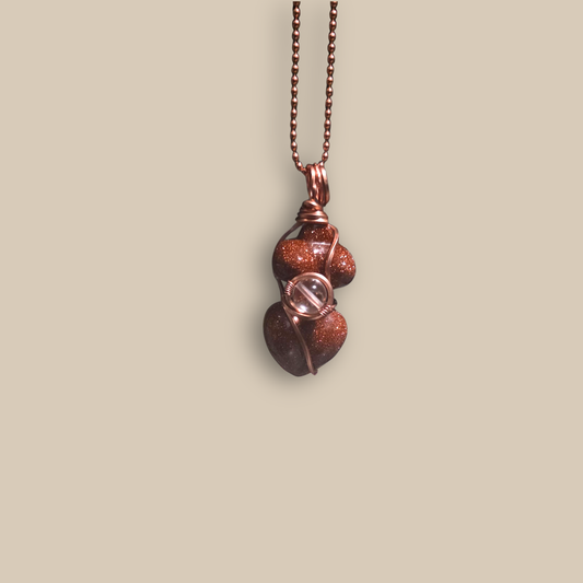 Goldstone copper-wrapped pendant by JvOR — handmade crystal jewelry for ambition, vitality, and positive energy.