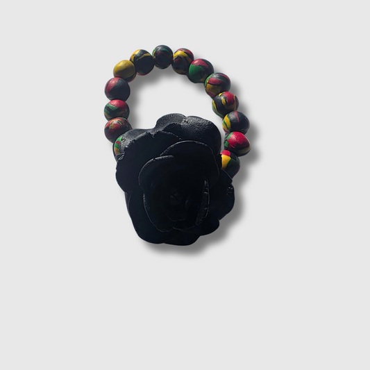 RUKIYA Pan-African bracelet with handcrafted polymer clay rose focal — handmade heritage jewelry by JvOR