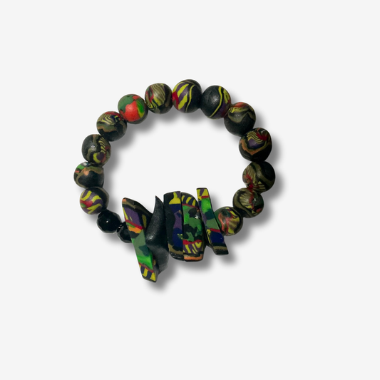 Bold handmade polymer clay bracelet with vibrant colors, featuring statement beads and some designs with spiked accents.