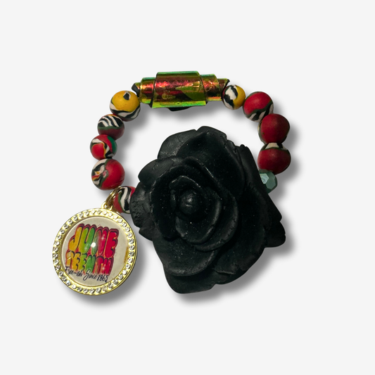 Handmade polymer clay bracelet with bright vibrant beads and sculpted clay roses as bold focal pieces