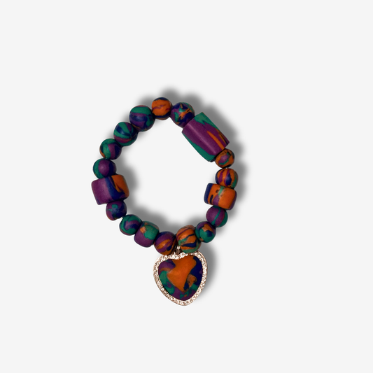 Bold handmade polymer clay bracelet with vibrant colors, featuring statement beads and some designs with spiked accents.