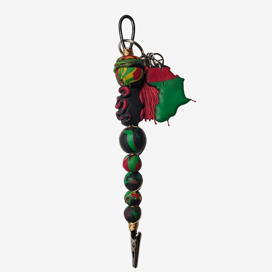 Handmade polymer clay card clips in Pan-African red, green, and black with bold textures and unique designs — functional accessories that celebrate culture and creativity