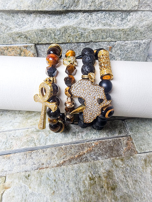 KALI BRACELET STACK IN EARTHLY BLACK AND GOLD WITH AFRICAN MOTIFS - SACRED PROTECTION & ANCESTRAL CONNECTION IN EVERY LAYER.